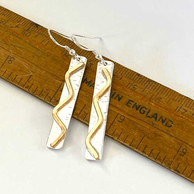 Sterling Silver with Copper Accent.