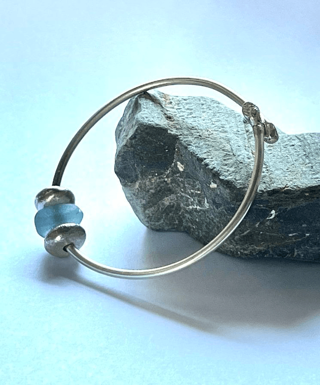 Silver Bangle with silver pebbles and aqua sea glass